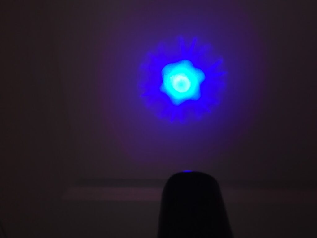 Terahertz Wand model "Big Blue" throwing off energy pattern on to the wall
